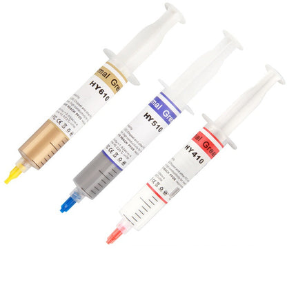 Grayline – Three thermal paste syringes in gold HY610, blue HY510 and red HY410 labels, fanned out on white