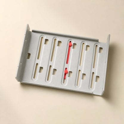 Driveclip – Red bracket pegs seated in the slotted openings of a grey metal drive bay tray