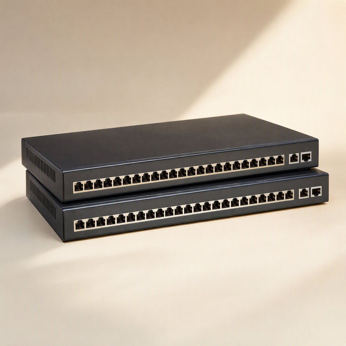 Shieldlink Cat6 Network Cable – two stacked black network switches with rows of Ethernet ports on a beige surface