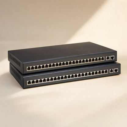Shieldlink Cat6 Network Cable – two stacked black network switches with rows of Ethernet ports on a beige surface