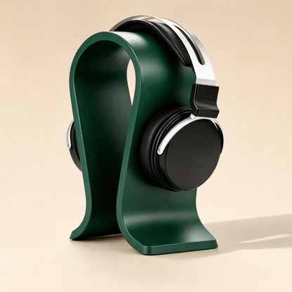 Headperch Aluminum Alloy Headphone Stand in dark green holding black over-ear headphones, angled front view