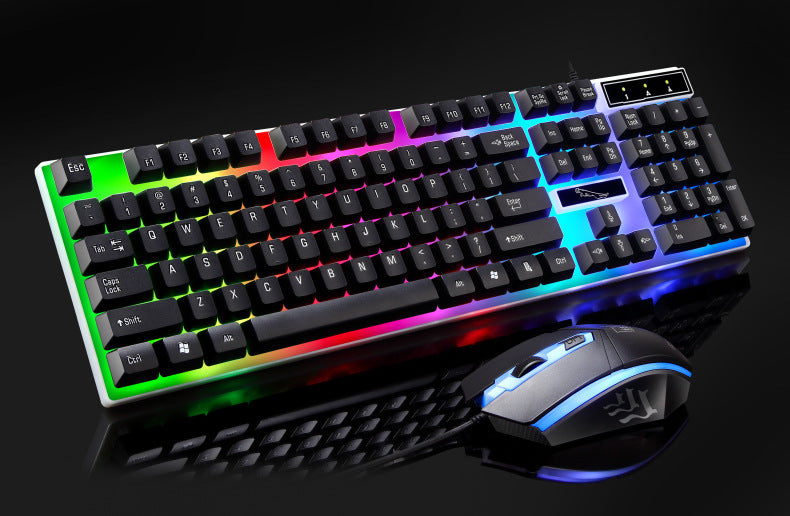 Glowtype – Black keyboard and mouse with rainbow backlit keys and a blue-lit mouse on a dark background