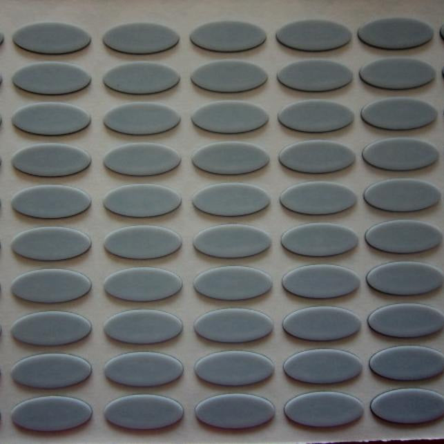 Slidefoot – Close-up of a sheet of gray oval mouse foot stickers arranged in rows