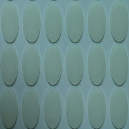 Slidefoot – Close-up of clear oval mouse foot stickers on a backing sheet, arranged in rows of vertical ovals