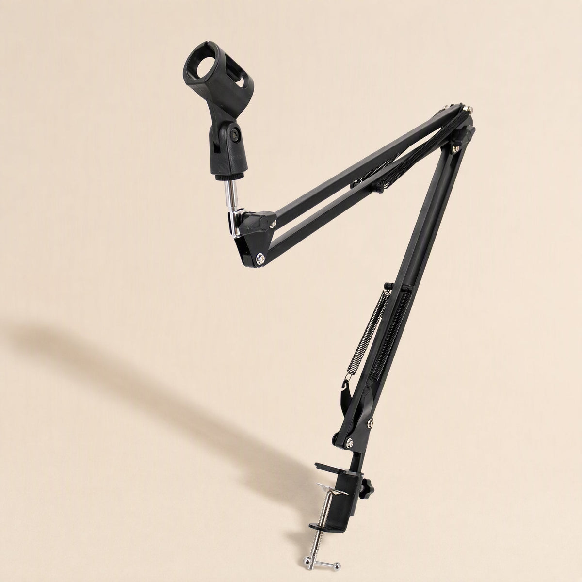 Reacharm Microphone Cantilever Bracket with mic clip raised, clamp base on beige background