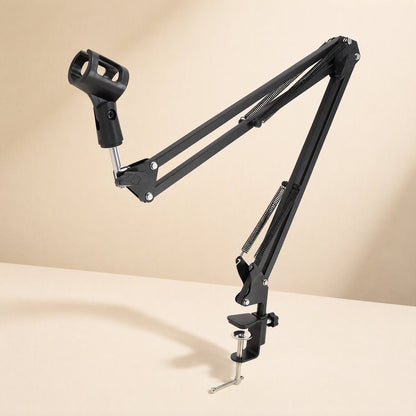 Reacharm – Black suspension boom arm with springs and mic clip, shown with clamp base against a cream backdrop