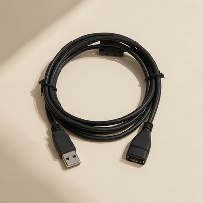 Reachcord – Coiled black USB extension cable with male plug and female socket, tied with small black ties, on cream