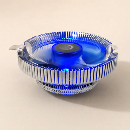 Metalbreeze Aluminum CPU Cooler Fan with glowing blue light, seen from the side on a cream background