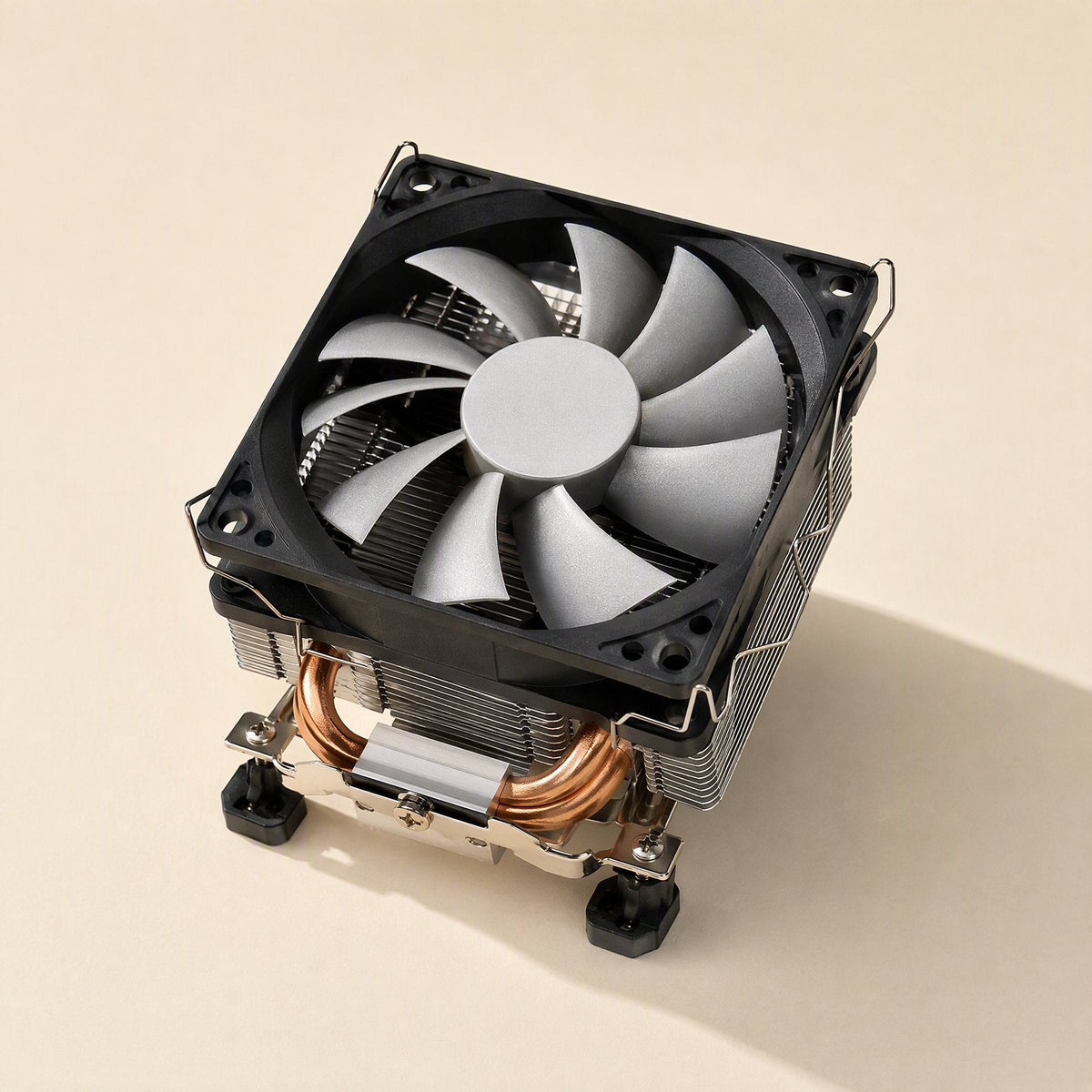 Metalbreeze – Tower-style CPU cooler with square black fan, copper heat pipes and black rubber feet, seen from above