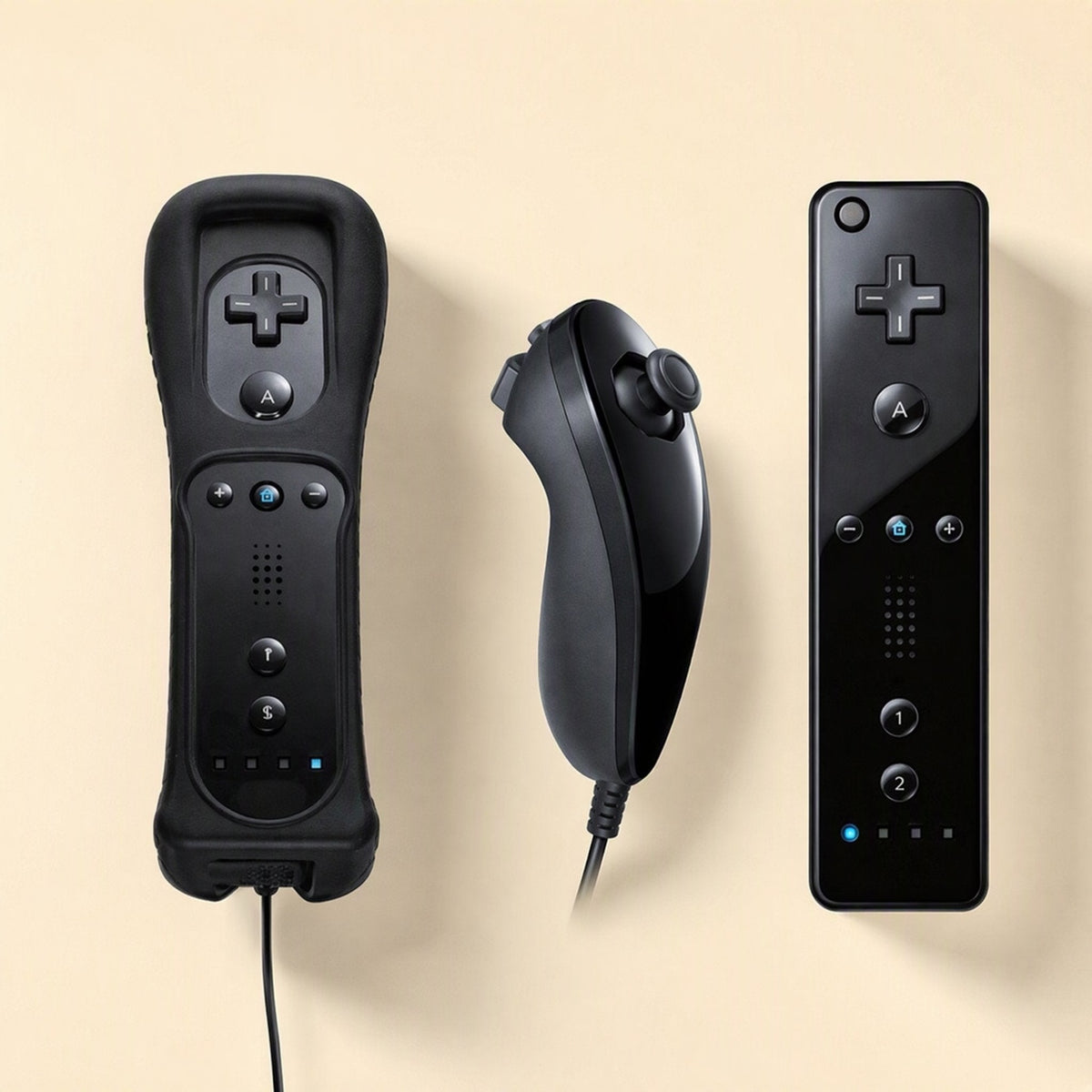Playgrip – Black remote with sleeve beside a black nunchuk and a bare glossy black remote on a cream background
