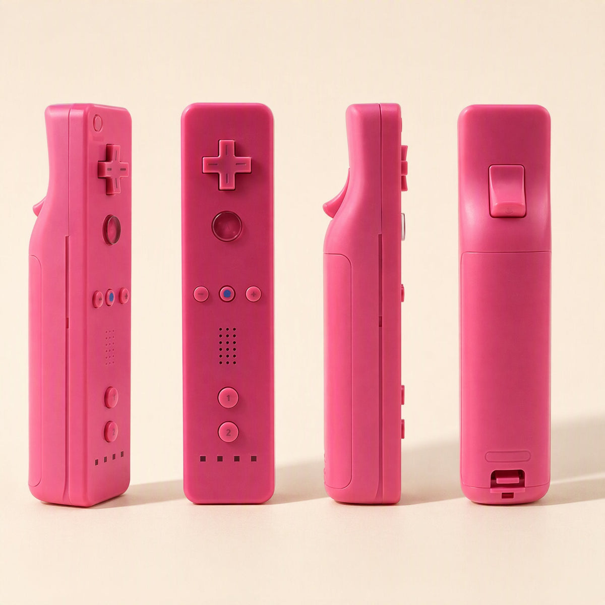 Playgrip – Pink Wii remote shown from four sides: front, left, right and bottom, with the strap-slot end at the base