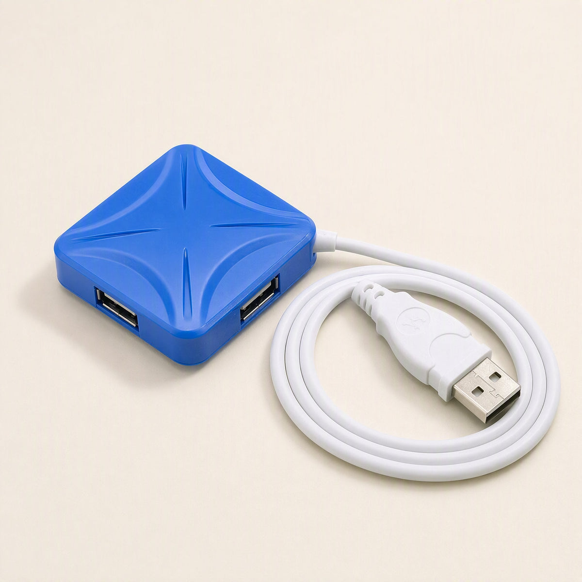 Portcluster – Blue square hub from above with X-shaped ridges, two USB ports visible and the cable looped around