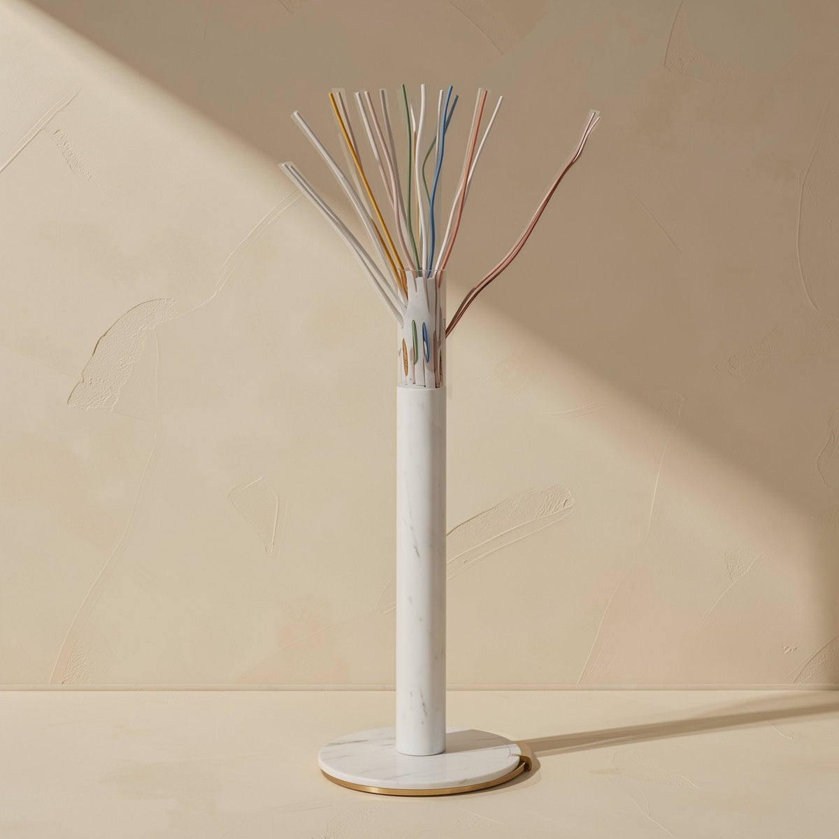 Flatlink – Cross-section of a flat cable on a marble stand, with colour-coded twisted wire pairs fanned out above