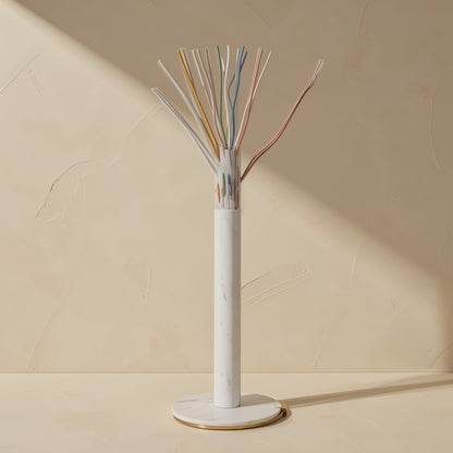 Flatlink – Cross-section of a flat cable on a marble stand, with colour-coded twisted wire pairs fanned out above
