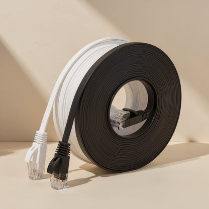 Flatlink – White and black flat cable rolls side by side, plugs at the front, from a slightly closer, lower angle