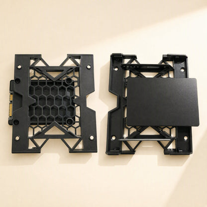 Drivecradle – Two black brackets side by side, one holding a 2.5-inch SSD with its SATA connector visible