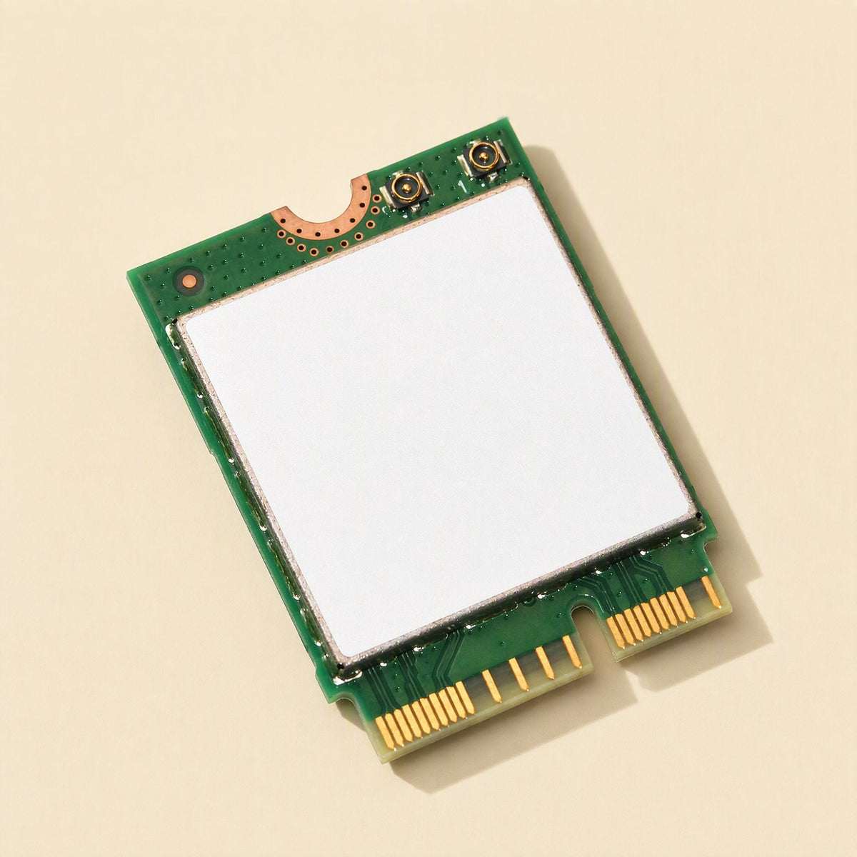 Keylink – Angled view of the green card with white shield, gold contacts and two small antenna connectors