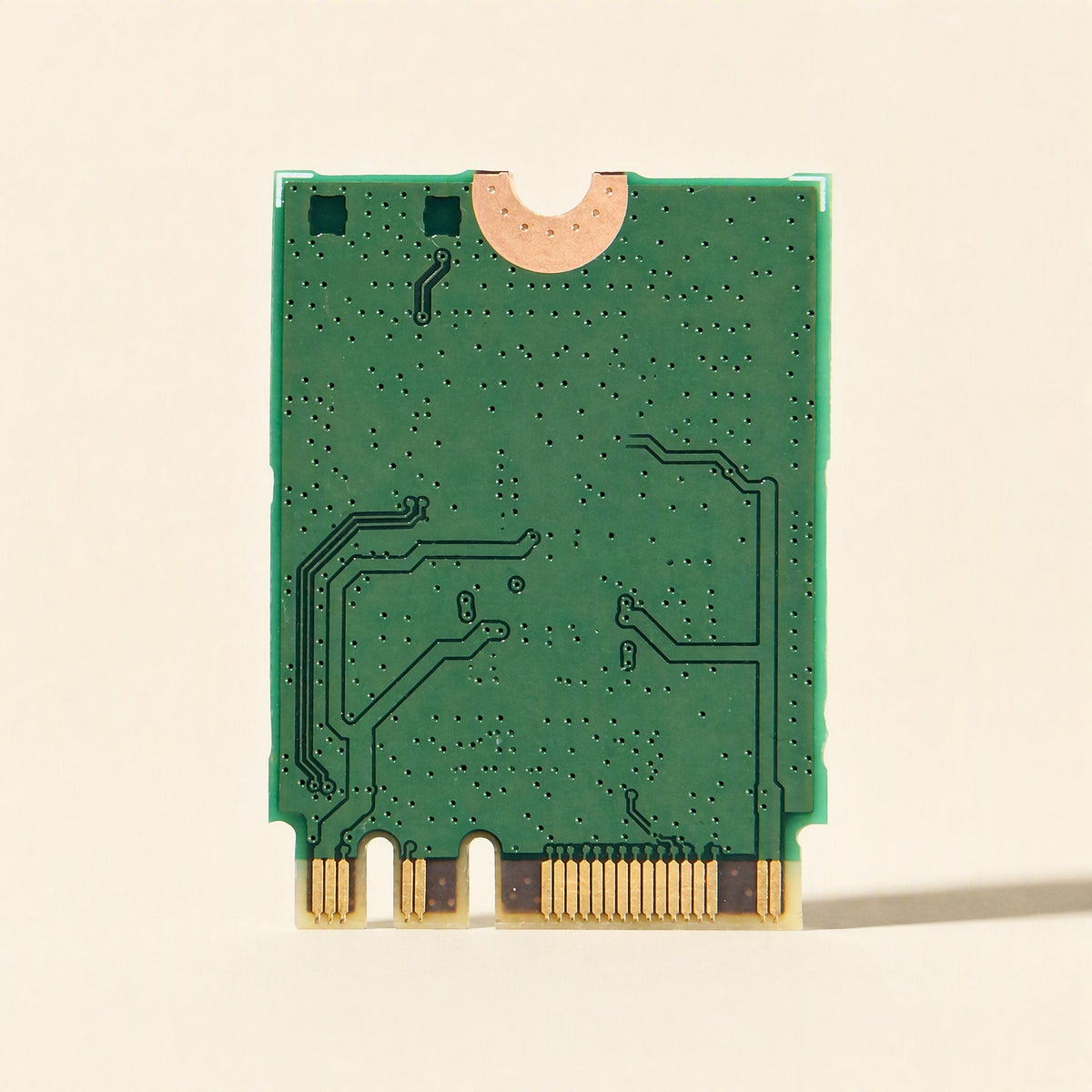 Keylink – Back of the green circuit board with gold edge contacts and a semicircular notch at the top