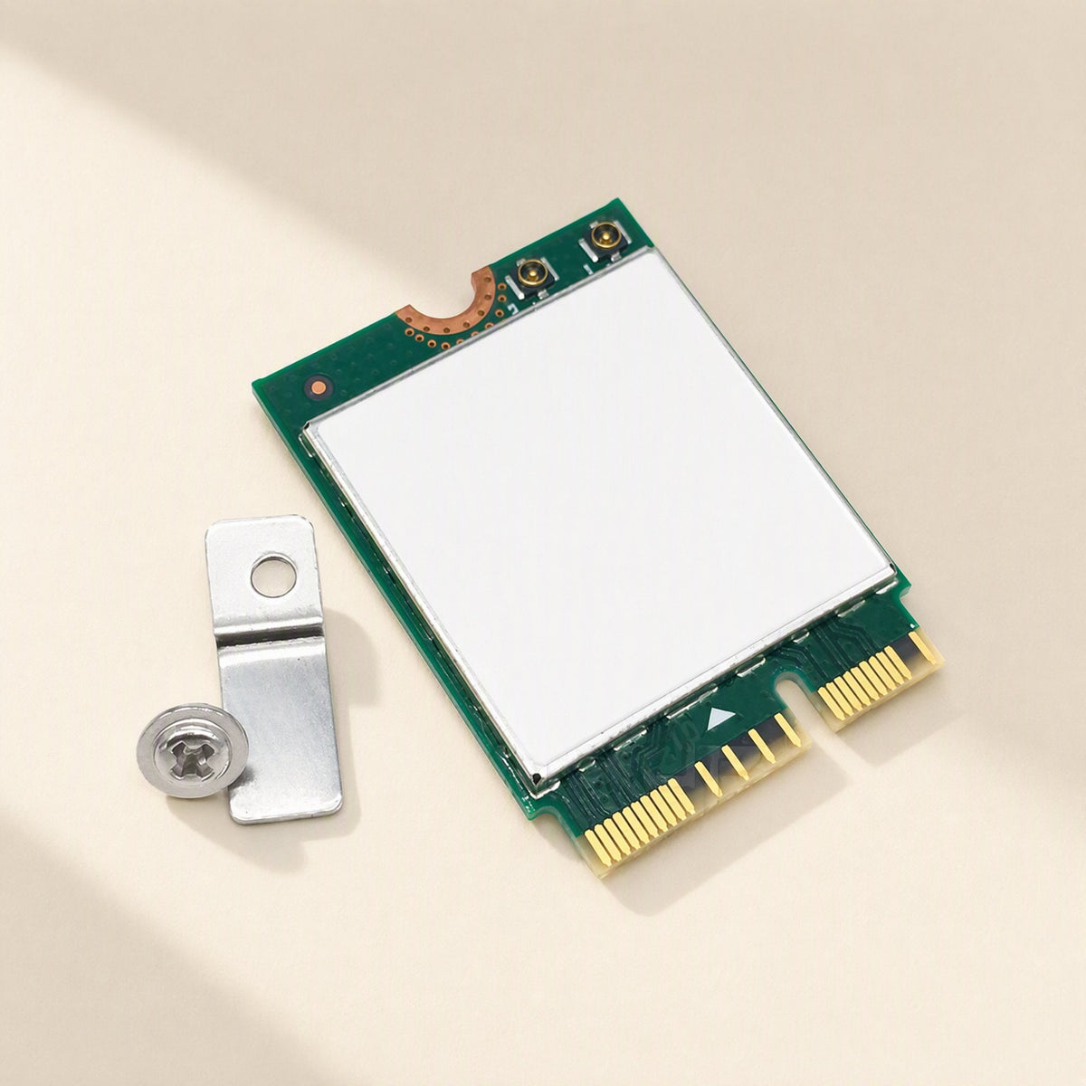 Keylink – Network card beside a small metal mounting bracket and a silver screw on a cream background