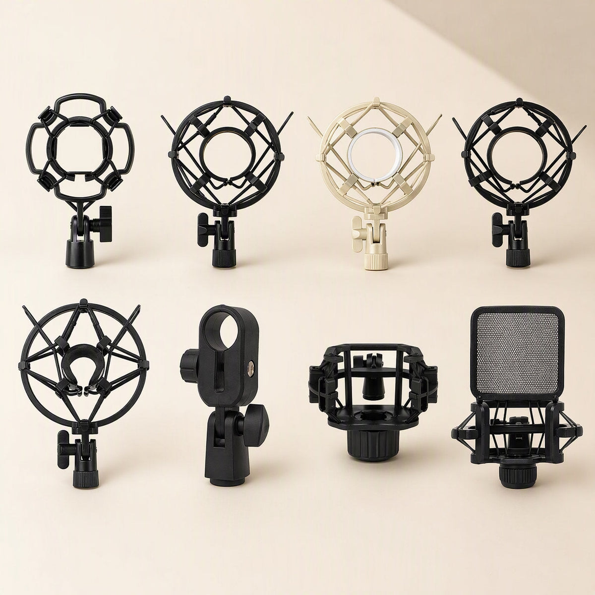 Joltcradle Microphone Shock Mount in eight styles, black and cream, arranged in two rows on a beige background