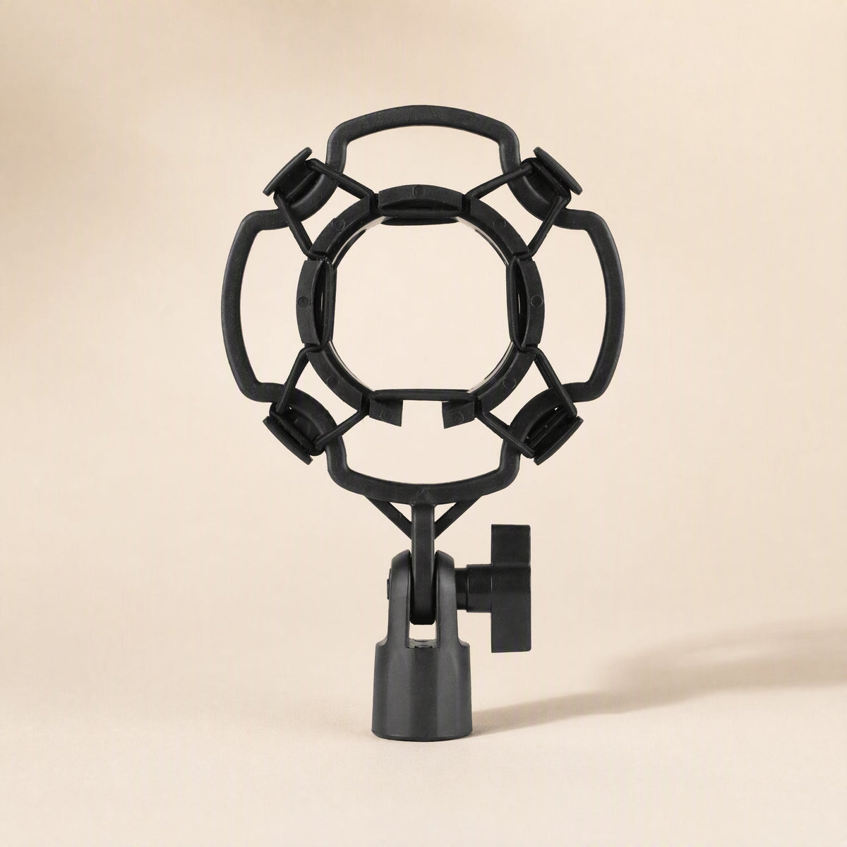 Joltcradle – Front view of a black plastic ring-style shock mount with four elastic-held corners and a tilting stand clamp