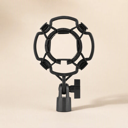 Joltcradle – Front view of a black plastic ring-style shock mount with four elastic-held corners and a tilting stand clamp