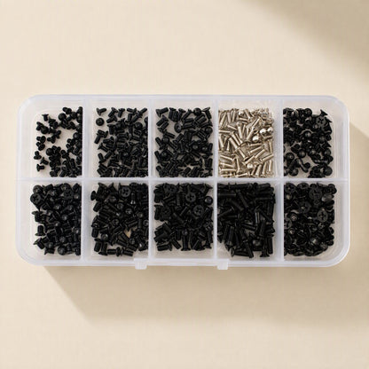 Microfast – Top-down view of black and silver countersunk screws sorted by size in a clear plastic organizer