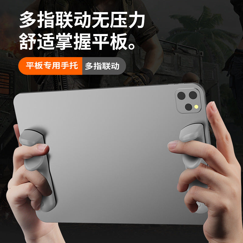 Tabletpalm Silicone Tablet Hand Grip pair attached to the back of a gray tablet, held in both hands