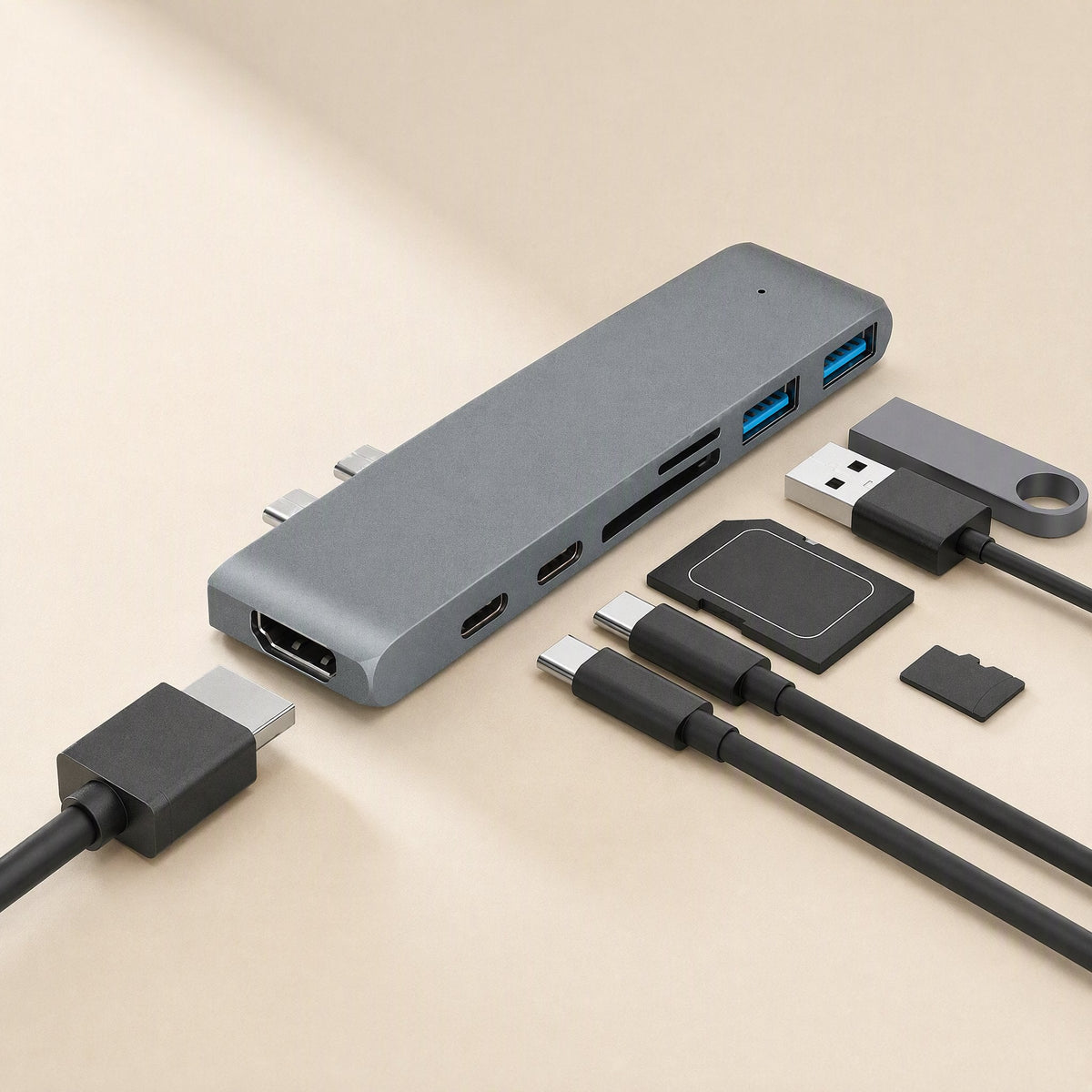 Linkdock Type-C 7-in-1 Docking Station in grey with HDMI, USB, SD cards and cables laid out around it
