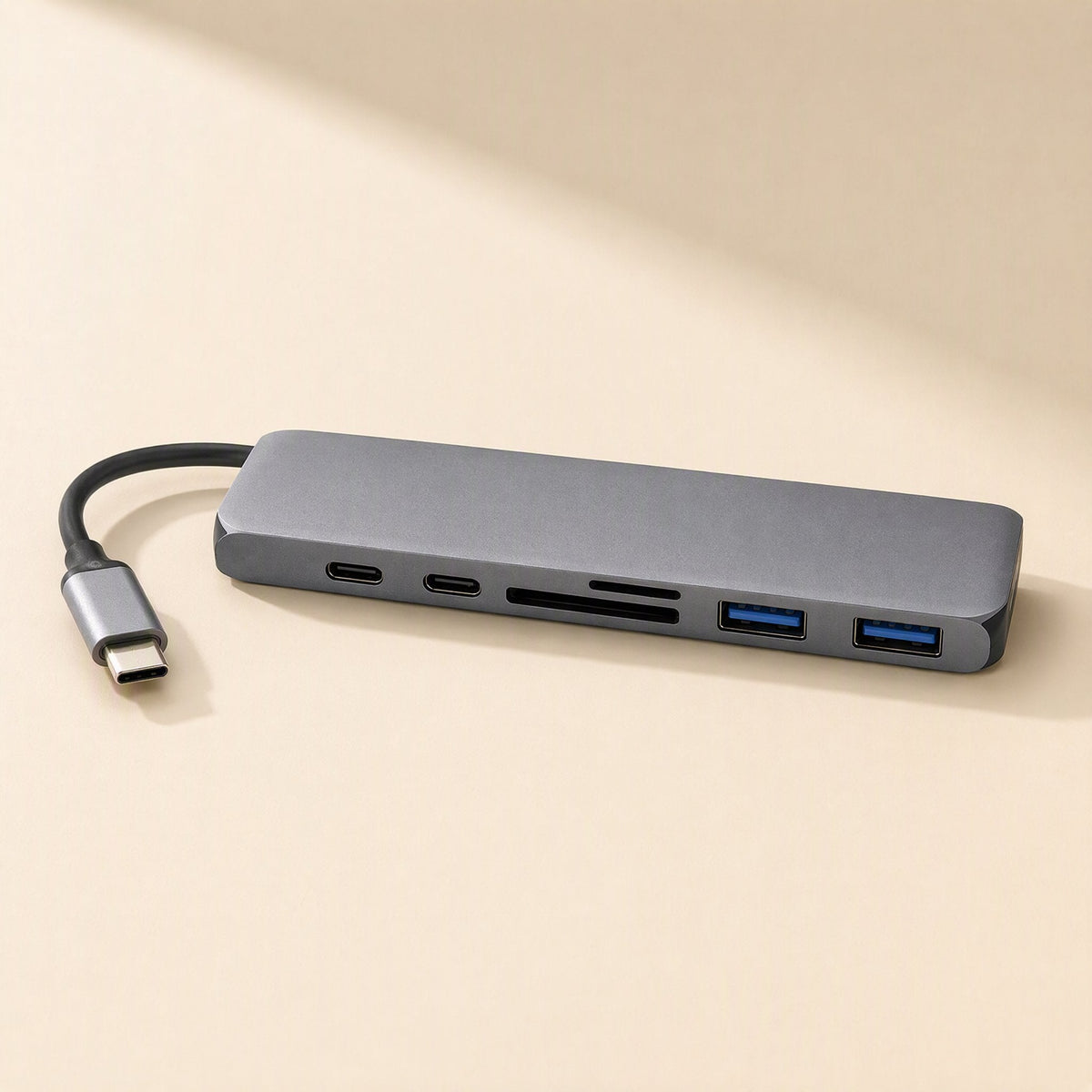 Linkdock – Grey dock with attached USB-C cable, showing two USB-C ports, card slots and two blue USB-A ports