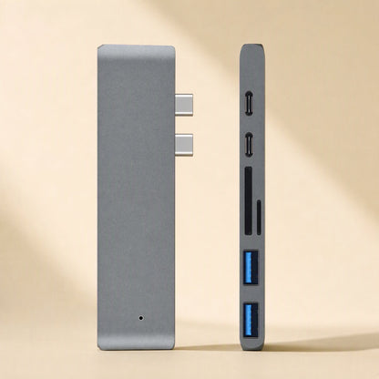 Linkdock – Front and side views of the grey dock showing dual USB-C connectors, card slots and blue USB-A ports