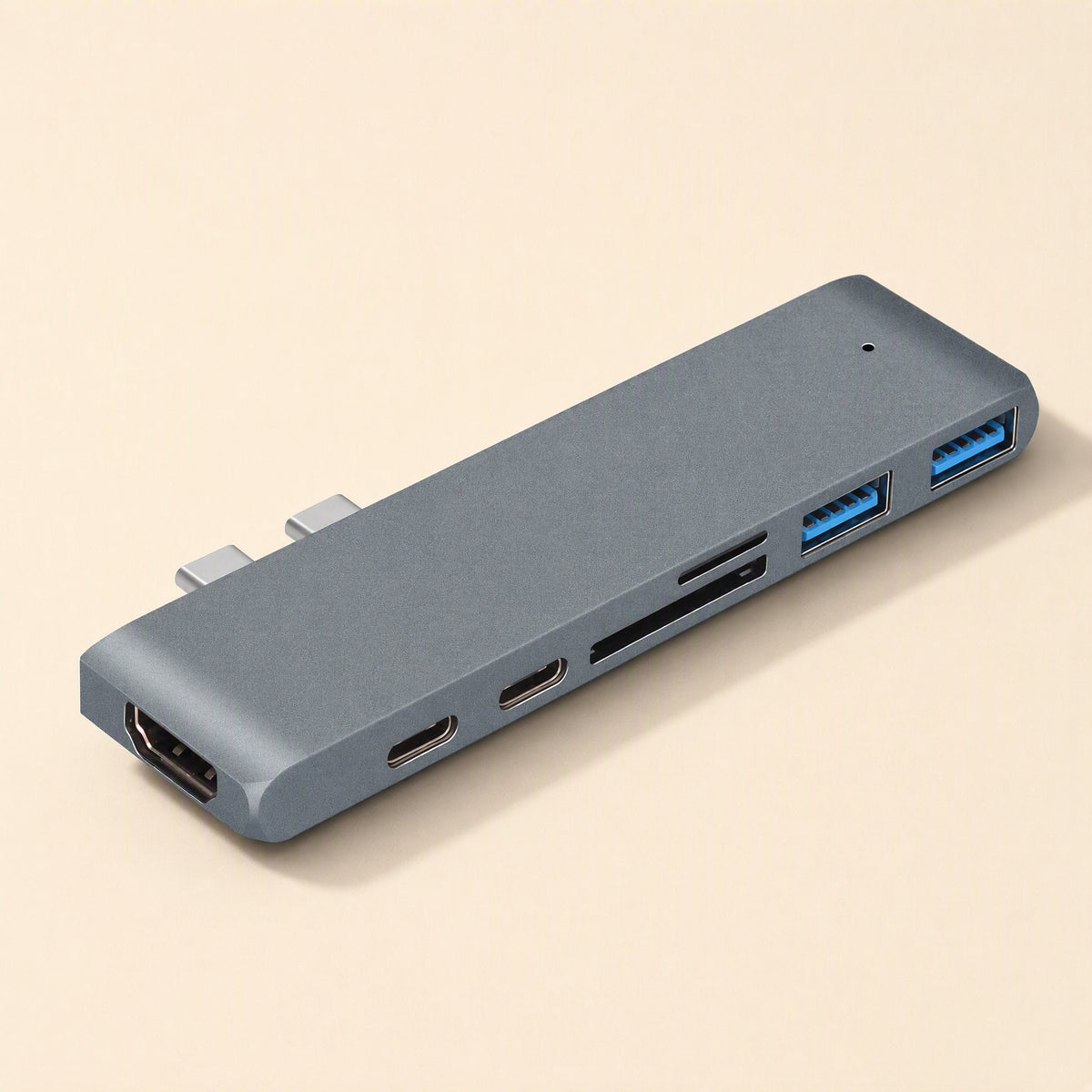 Linkdock – Grey aluminium dock at an angle showing the HDMI port, two USB-C ports, card slots and two blue USB ports