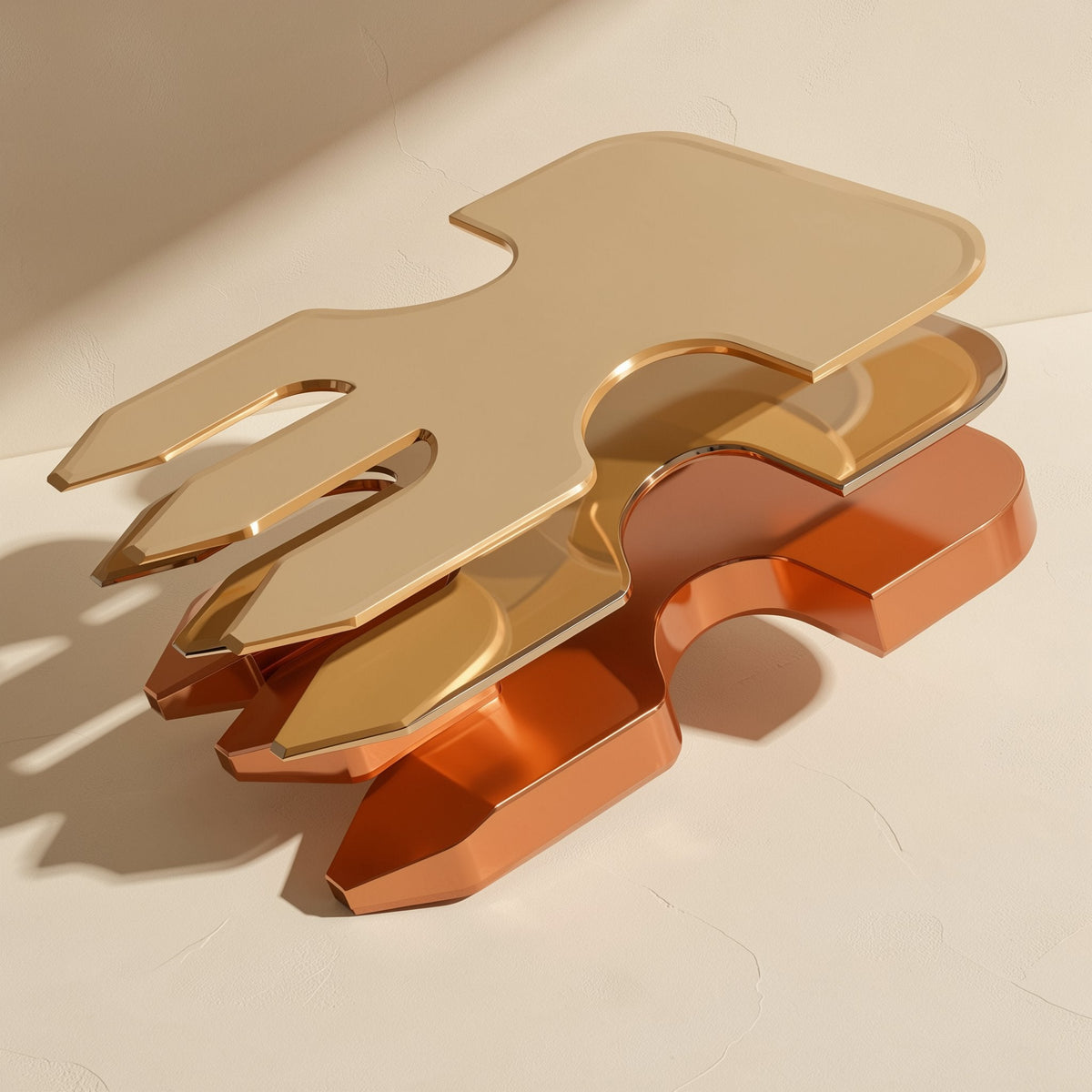 Cableclick – Stacked gold and copper-toned metal parts in a graduated, fork-like shape on a cream surface