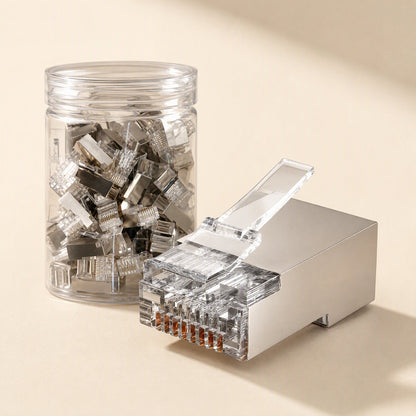 Netclick – Shielded metal-housing RJ45 connectors, one in front of a clear jar filled with more connectors