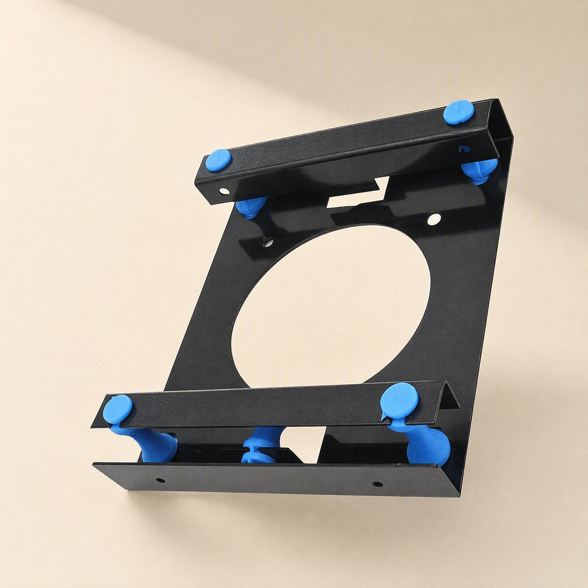 Rackshift 3.5 to 5.25-inch hard drive rack, black metal bracket with blue shock-absorbing pegs, angled view