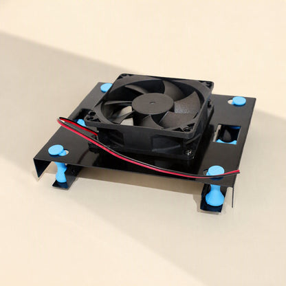 Rackshift – Black drive bracket with a cooling fan mounted over the round cutout, red and black wire trailing