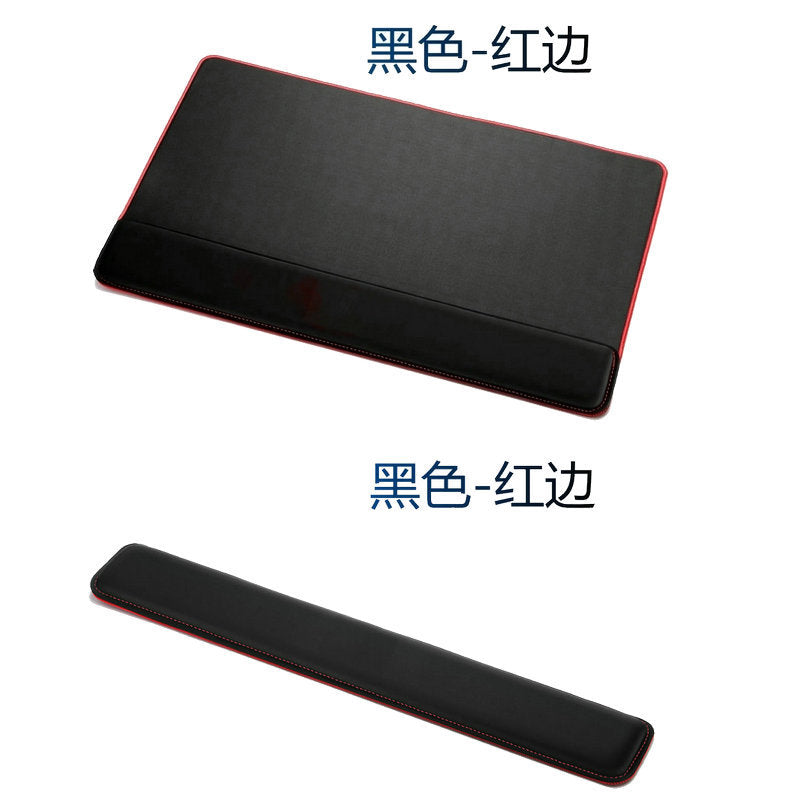 Padrest – Black desk pad with red edge stitching shown above a separate matching wrist rest strip