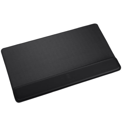 Padrest – Large black desk pad with attached wrist rest along the front edge, seen from above at an angle