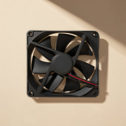 Bladechill – Square black fan mounted flat against a beige wall, angled view showing corner screw holes and shadow