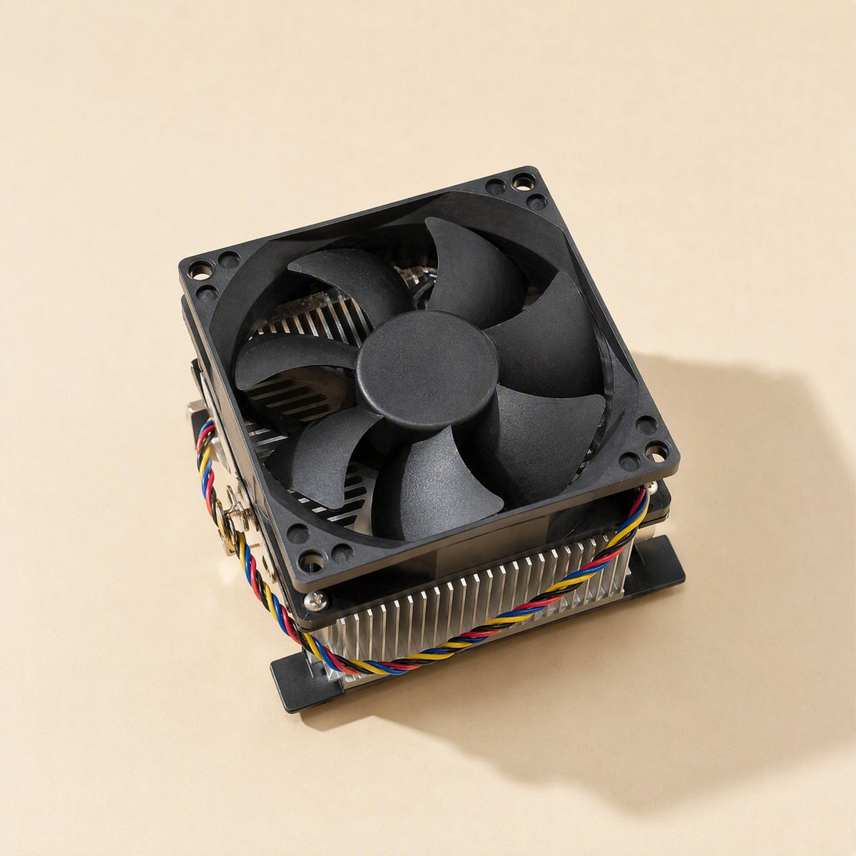 Socketchill CPU Cooler – top-down view of the black 4-wire fan with seven blades mounted above the finned heat sink