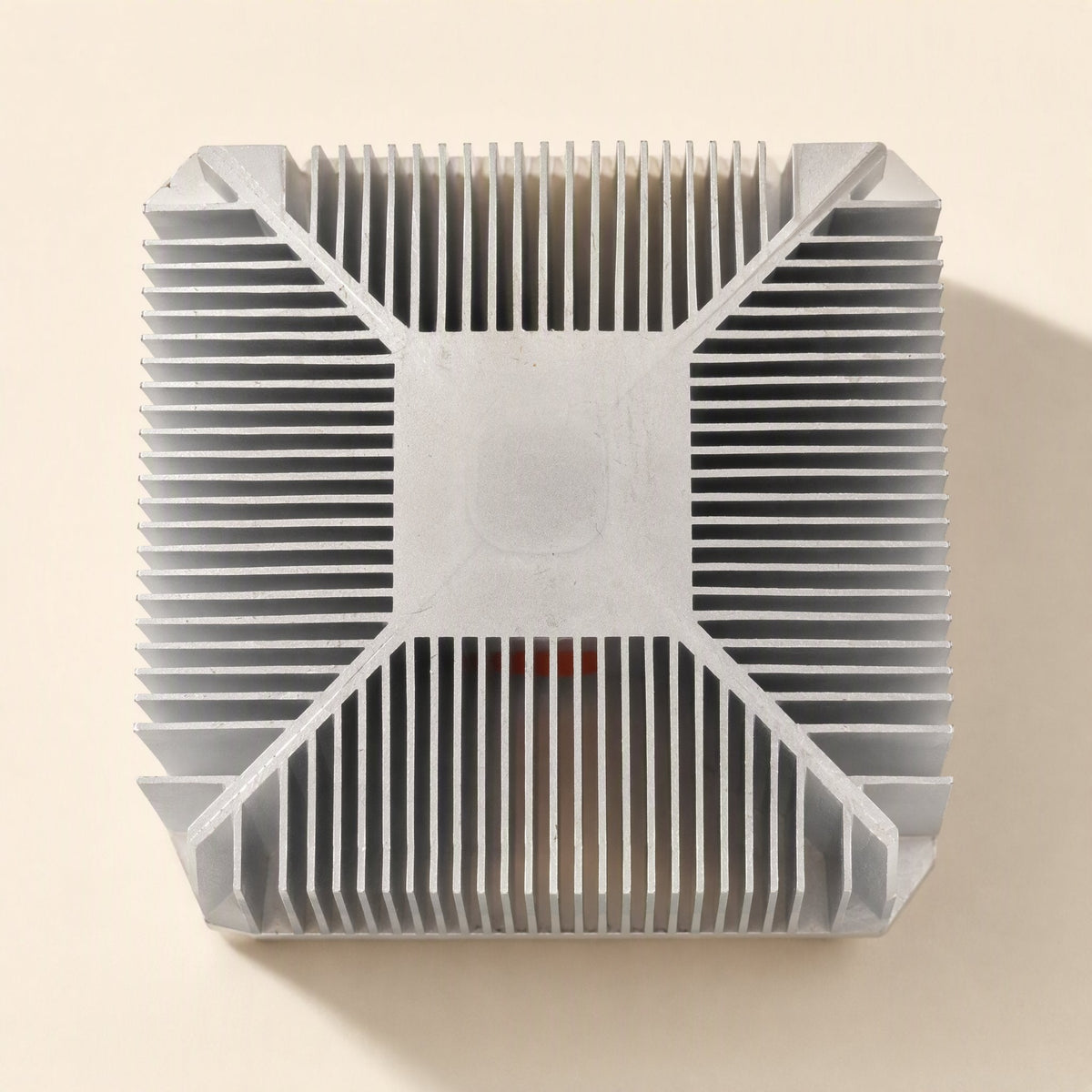 Socketchill CPU Cooler – underside of the aluminum heat sink showing the flat square contact plate and diagonal fin pattern