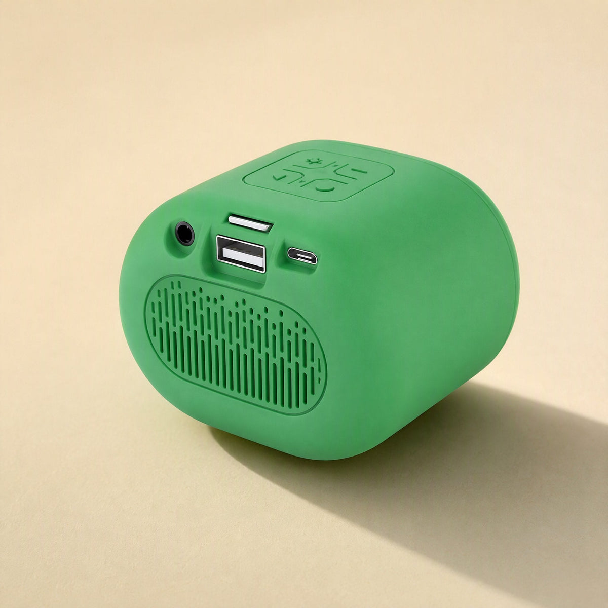 Beatburst – Green speaker rear view showing aux jack, card slot, USB port and charging port above a vented panel