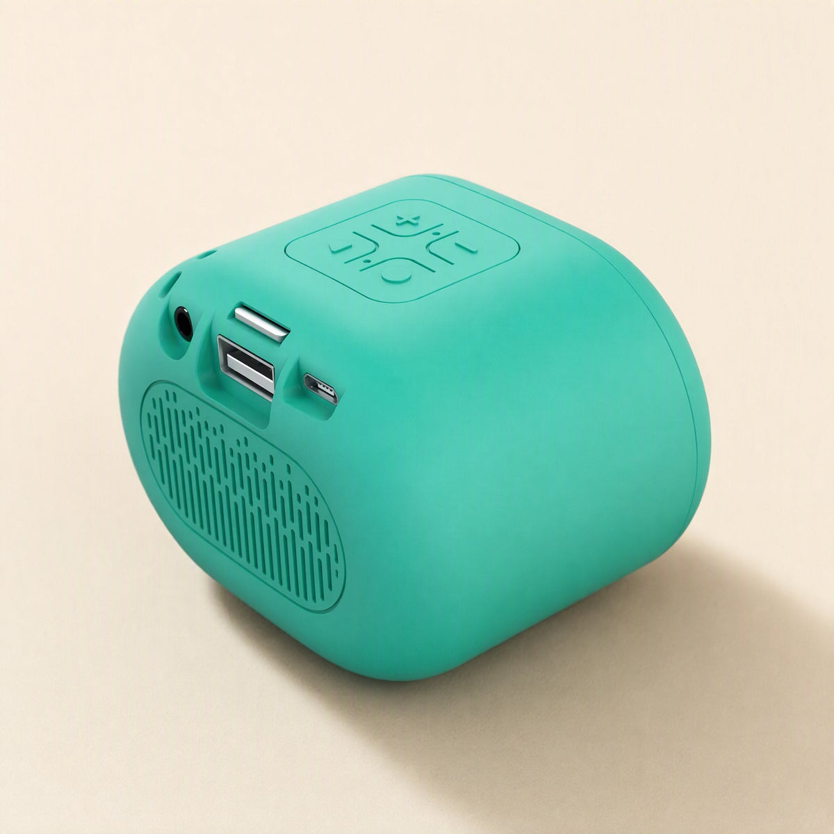 Beatburst – Teal speaker back view with aux jack, card slot, USB and charging ports and a slotted vent below