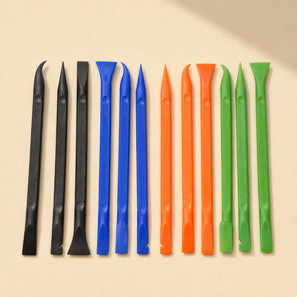 Prywise mobile phone pry tool set of twelve plastic spudgers in black, blue, orange and green on beige