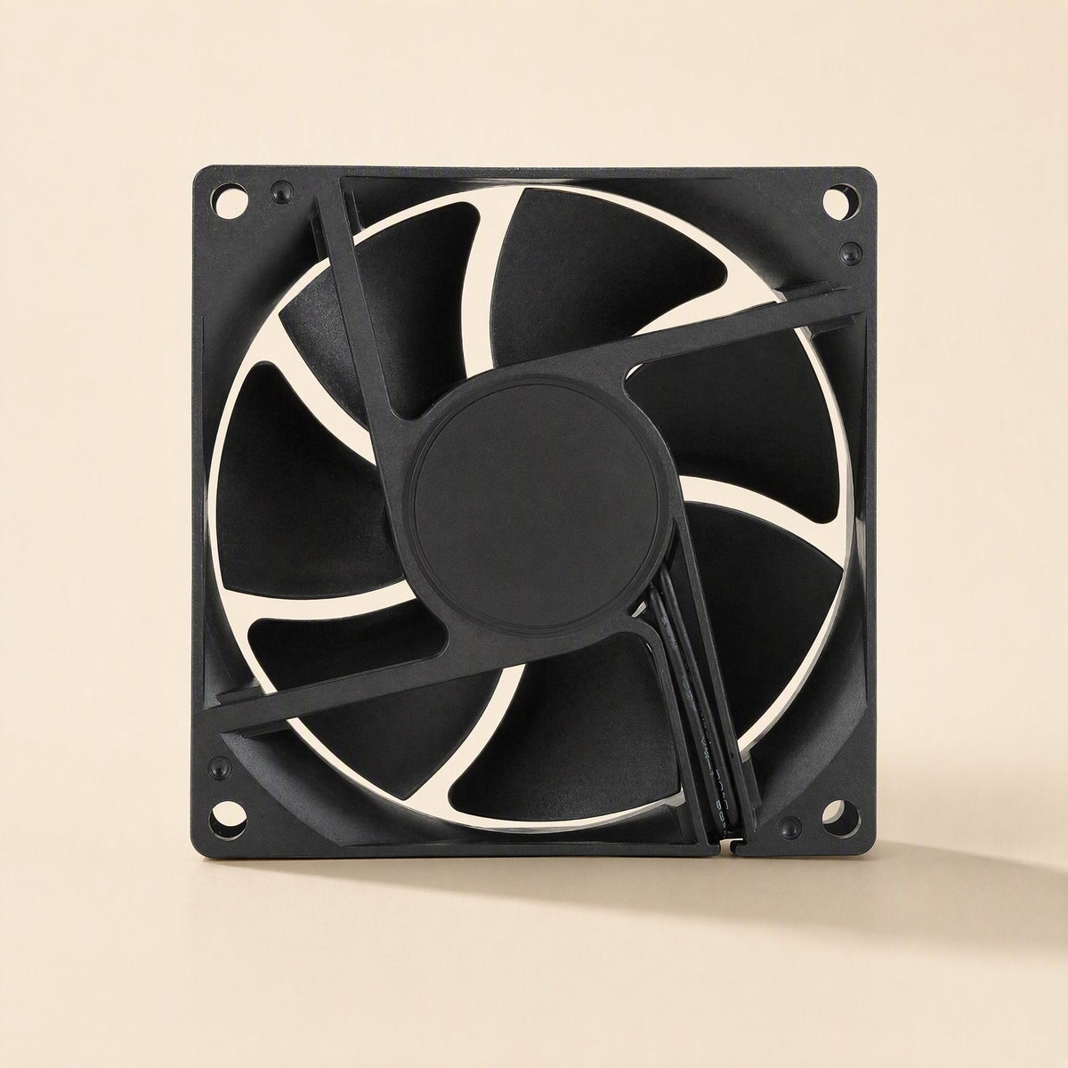 Casecool – Straight-on rear view of the black fan with corner mounting holes and cable routed along one strut