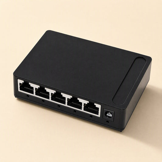 Portstream – Black 5-port network switch from behind at an angle, showing the Ethernet ports and DC power socket