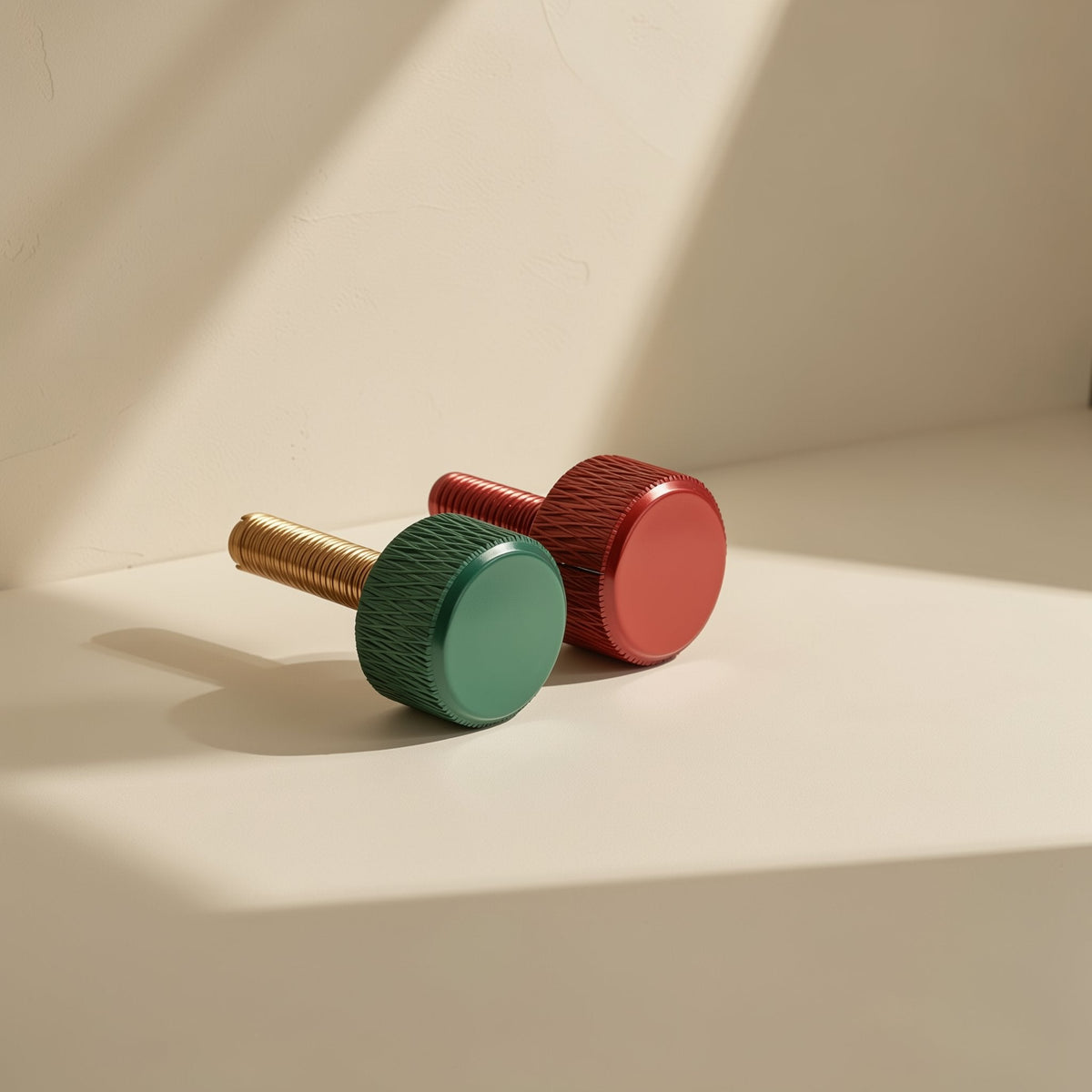Gripturn Aluminum Alloy Knurled Thumb Screw in green and red on a sunlit beige surface