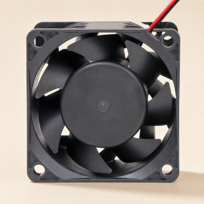 Windcraft DC Cooling Fan – front view of a square black cooling fan showing seven curved blades and a round central hub