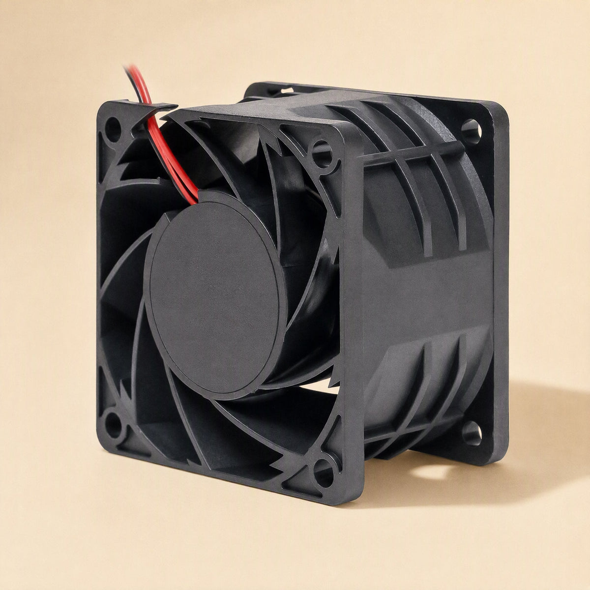 Windcraft – Side three-quarter view of a black square fan frame with ribbed housing and red and black wires at the top