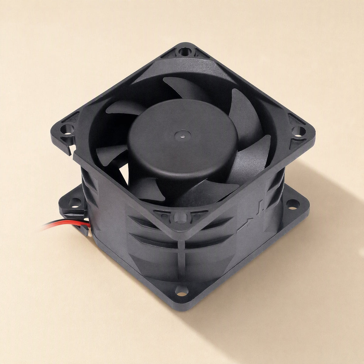 Windcraft DC Cooling Fan – top-down angled view of a black square fan showing the hub, blades and ribbed side housing